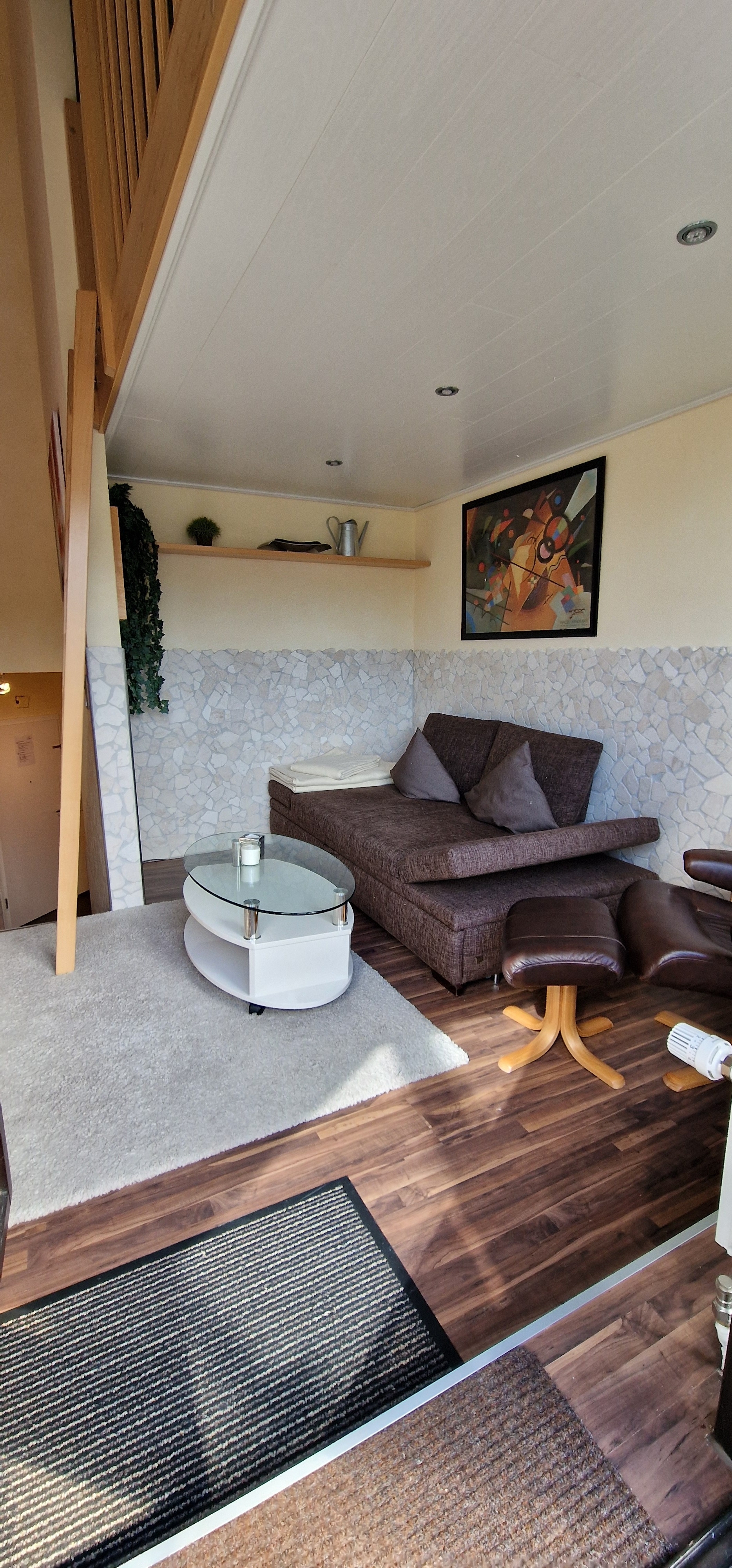 a room with a couch and curtains